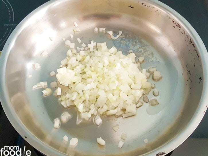 frying onions in skillet