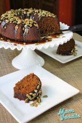 oatmeal-molasses pumpkin cake with caramel glaze and candied pumpkin seeds