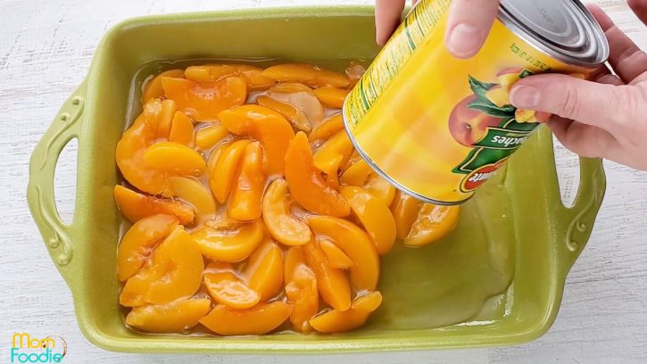 canned peaches dumped into casserole dish