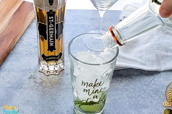 pour vodka into cocktail shaker