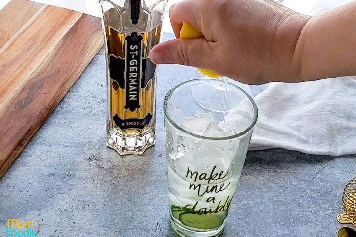 squeeze fresh lemon into mixing glass