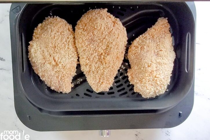 raw chicken in air fryer basket