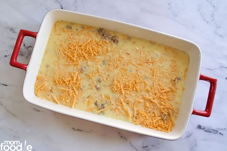 breakfast casserole with cheese ready for oven