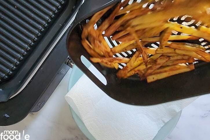 dumping fries out of air fryer basket
