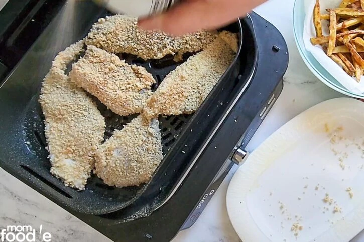 arrange fish in air fryer basket oiled side down and apply cooking spray to tops