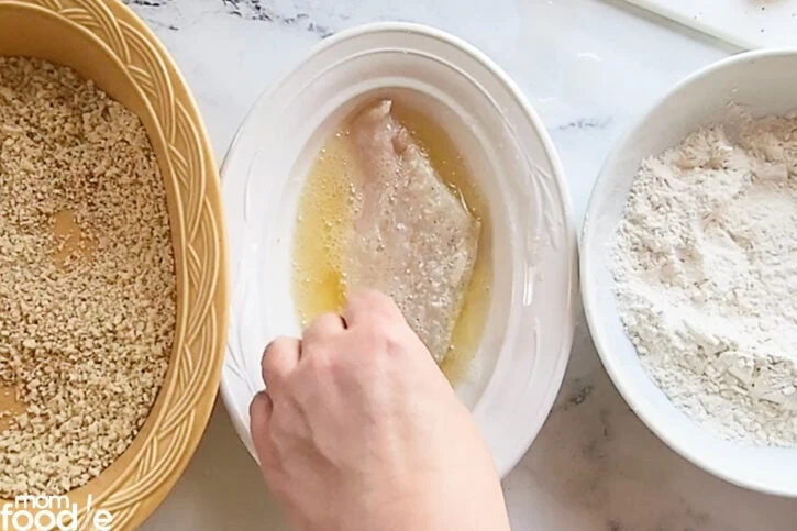 dredging fish in egg wash