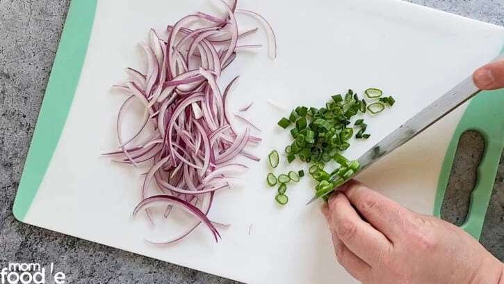 Slice the onion and scallion for the Asian cucumber salad recipe