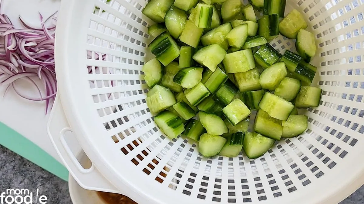 Drain the salted Cucumbers with a colander or pot strainer.