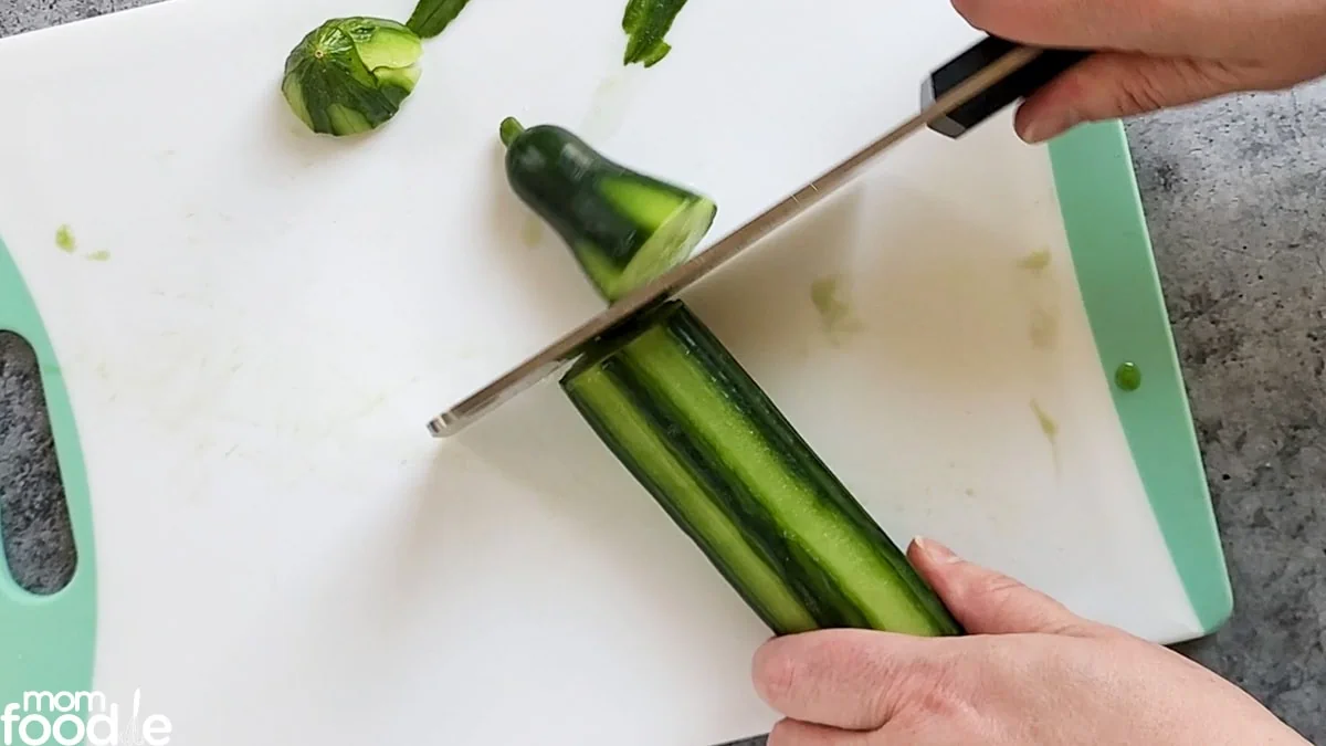 chop off ends of the cucumber.