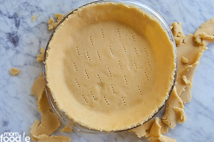 Prick the bottom of the pie crust with a fork.