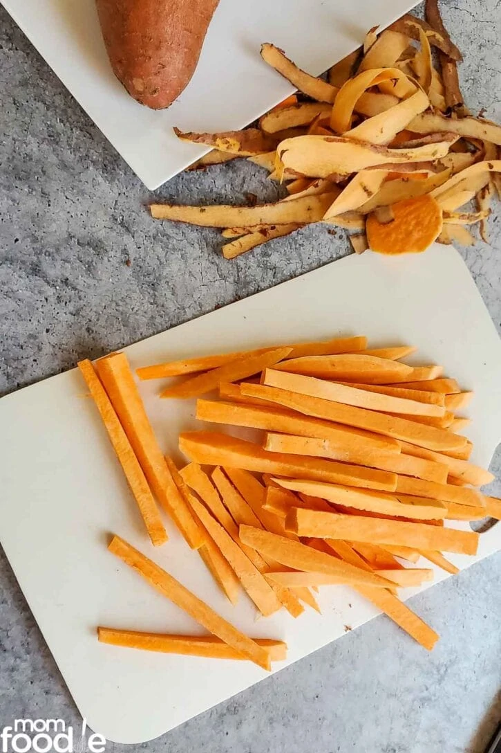 Peeling the sweet potatoes and cutting into fries.