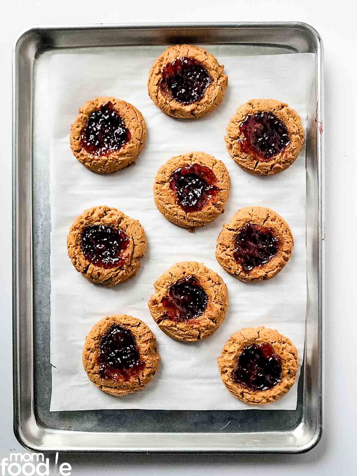cookies with jam added to the thumbprint indents