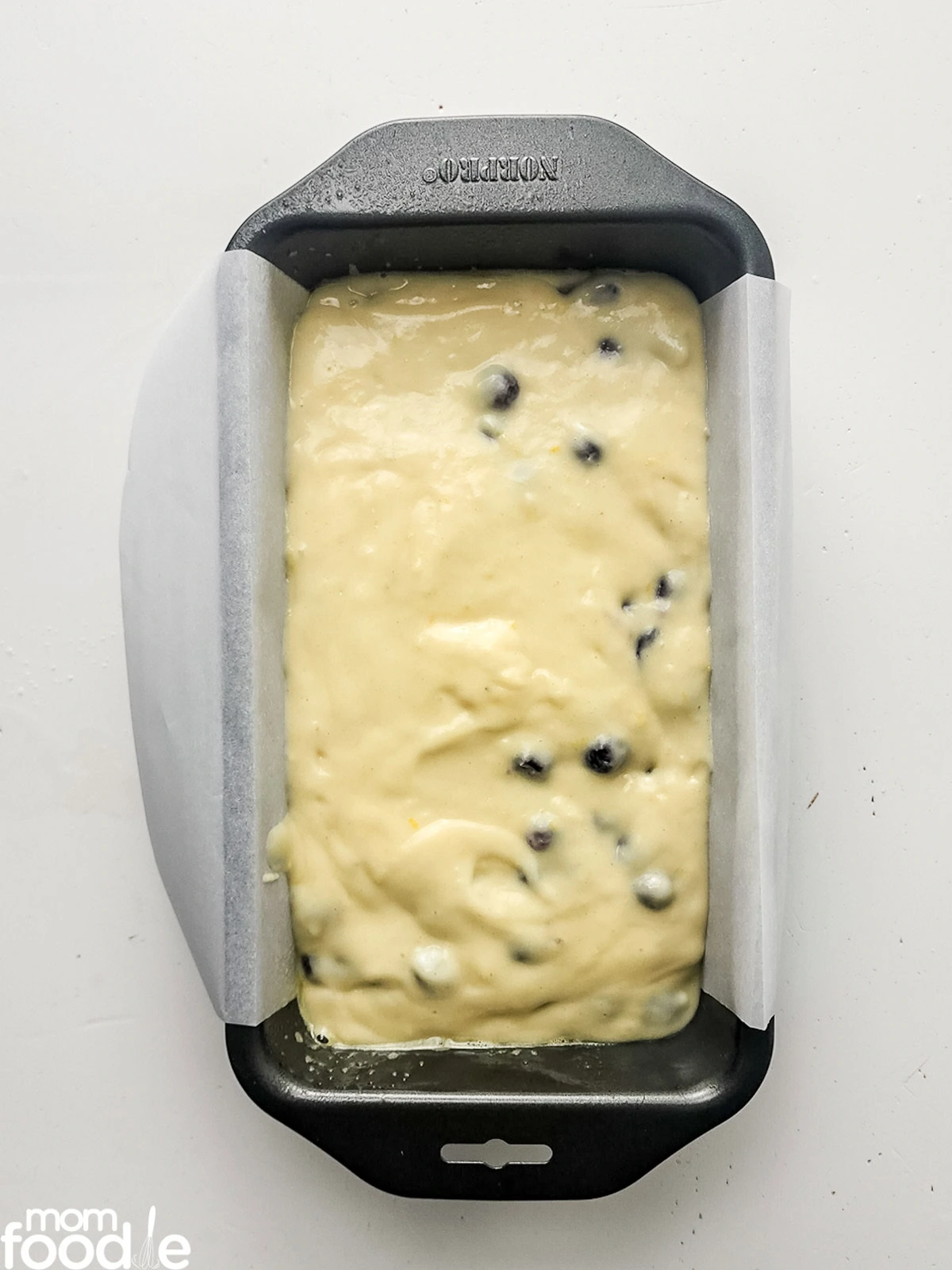 lemon blueberry bread batter in loaf pan