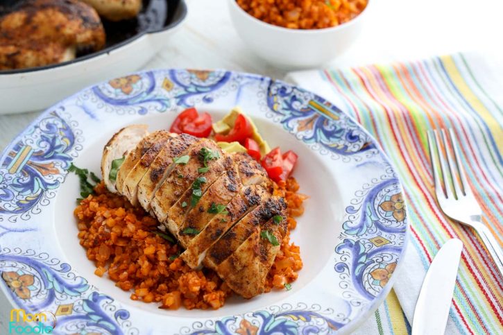 sliced Cajun chicken breasts over cauliflower rice