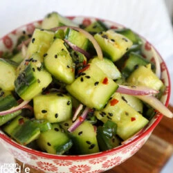 Asian Cucumber Salad Recipe served in bowl.