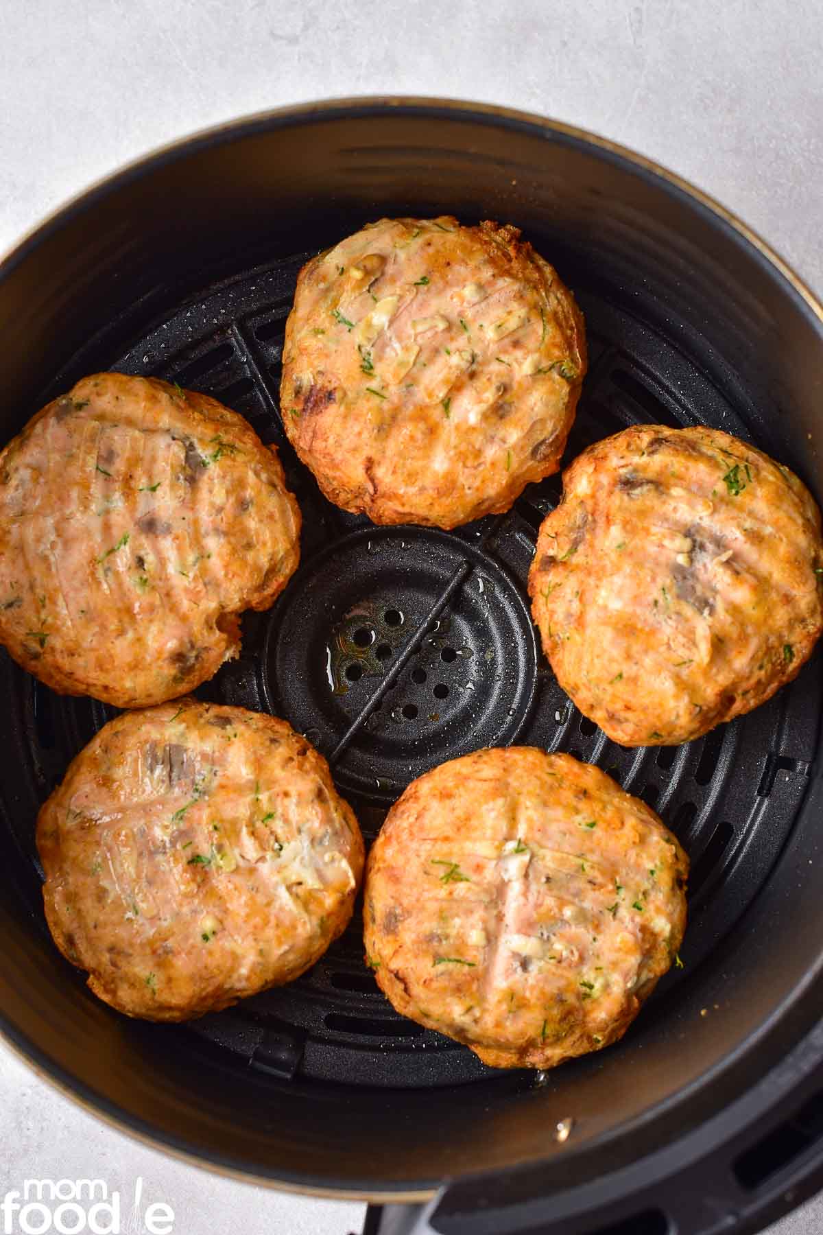 flipped over air fryer salmon cakes