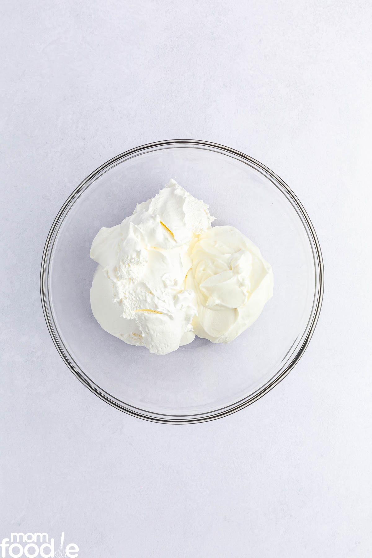 yogurt (or sour cream) and cool whip in bowl