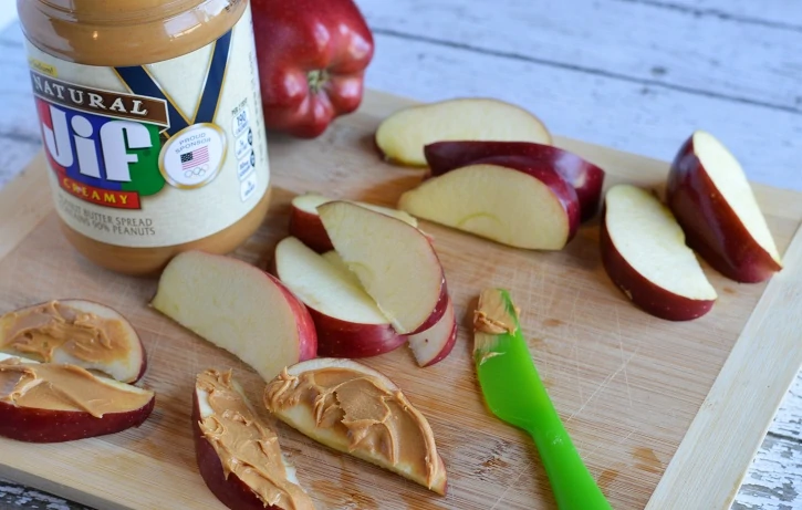 Apple Peanut Butter Teeth - applying peanut butter