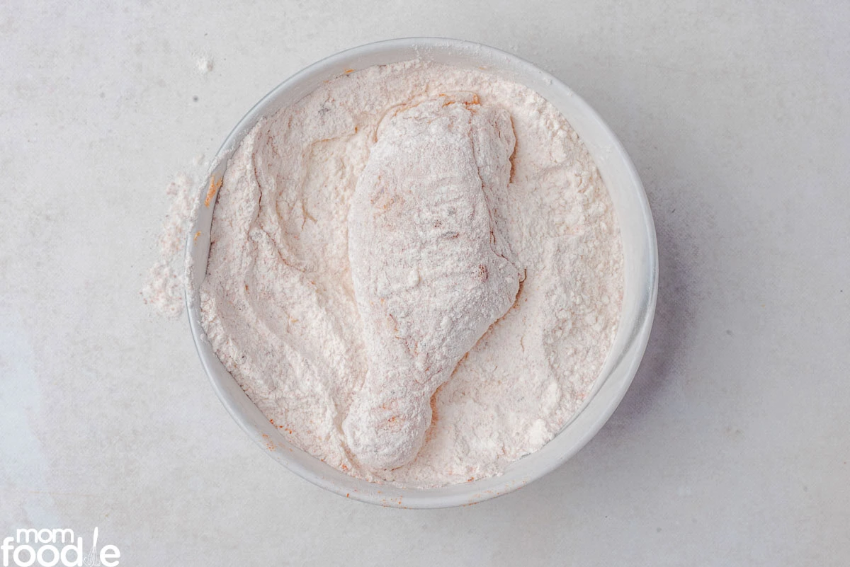 piece if chicken in flour mixture