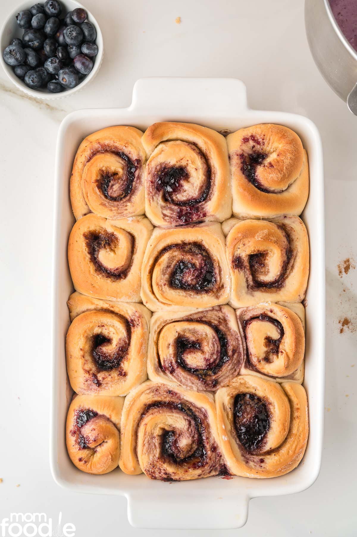 Baked blueberry rolls in casserole dish