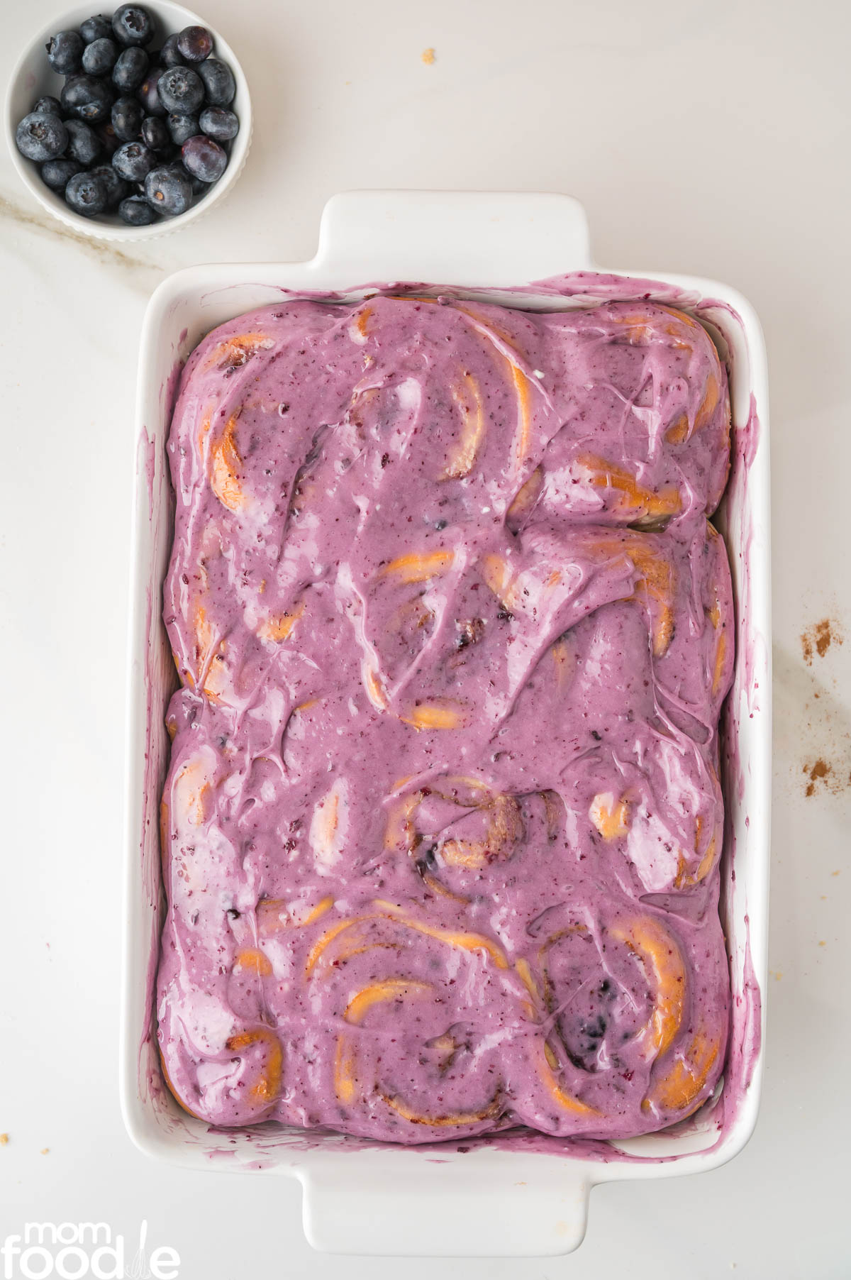 blueberry icing slathered over the top of the blueberry cinnamon buns