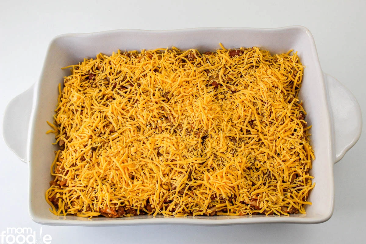 chili hash browns and cheese in baking dish