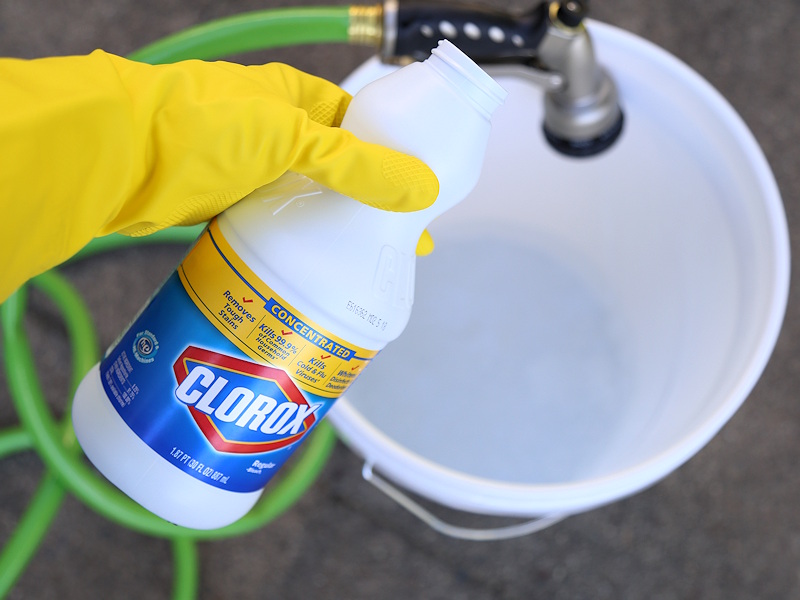 Cleaning A Concrete Patio Furniture Using Bleach As Disinfectant Outdoors - How To Clean Patio With Bleach