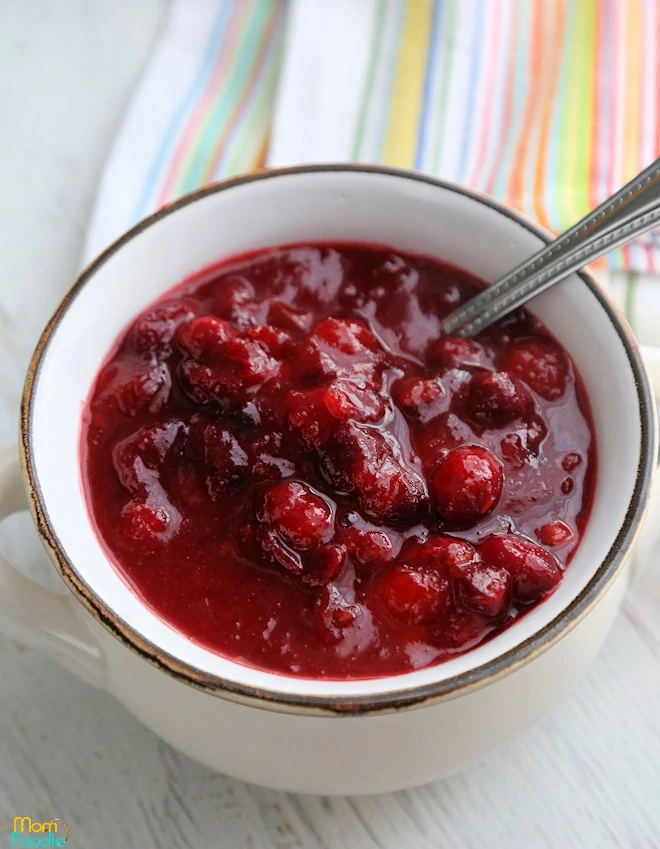 Cranberry Orange Sauce ready for Thanksgiving or Christmas in bowl with spoon.
