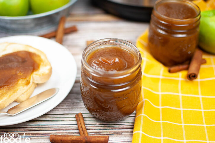 Apple butter in mason jar and served on toast.