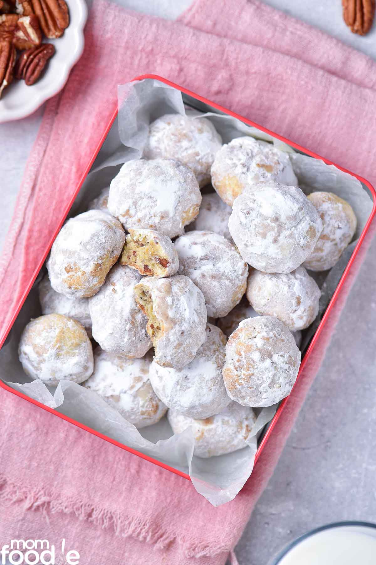 snowball cookies in cookie tin
