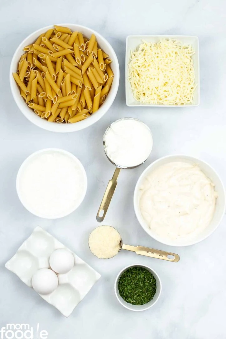 Ingredients for baked ziti with alfredo sauce.