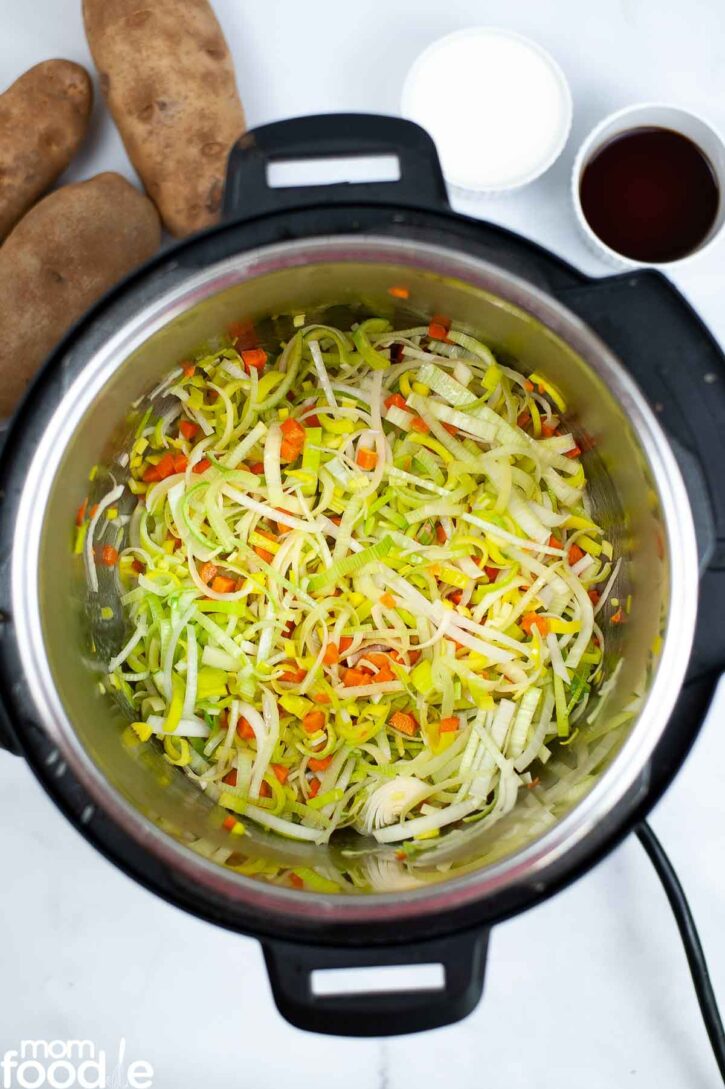 Carrots and leeks in the Instant Pot, ready to saute.
