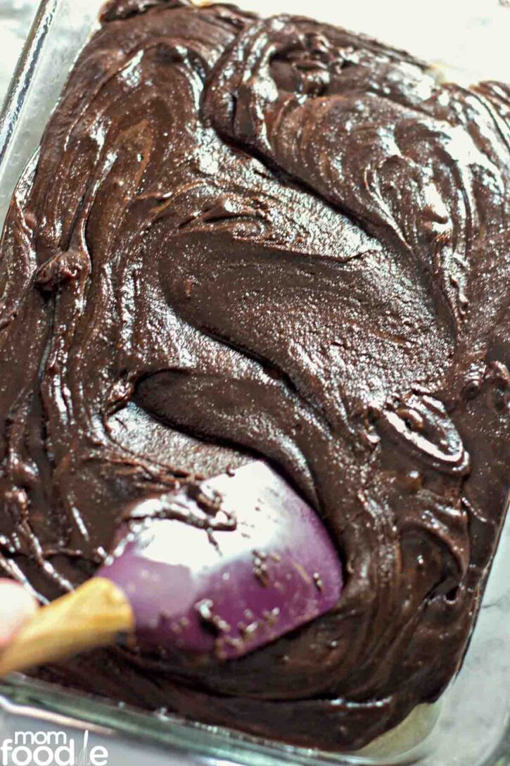 spreading out batter in bronie pan.