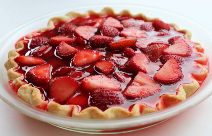 made jello over fresh strawberries ready to chill