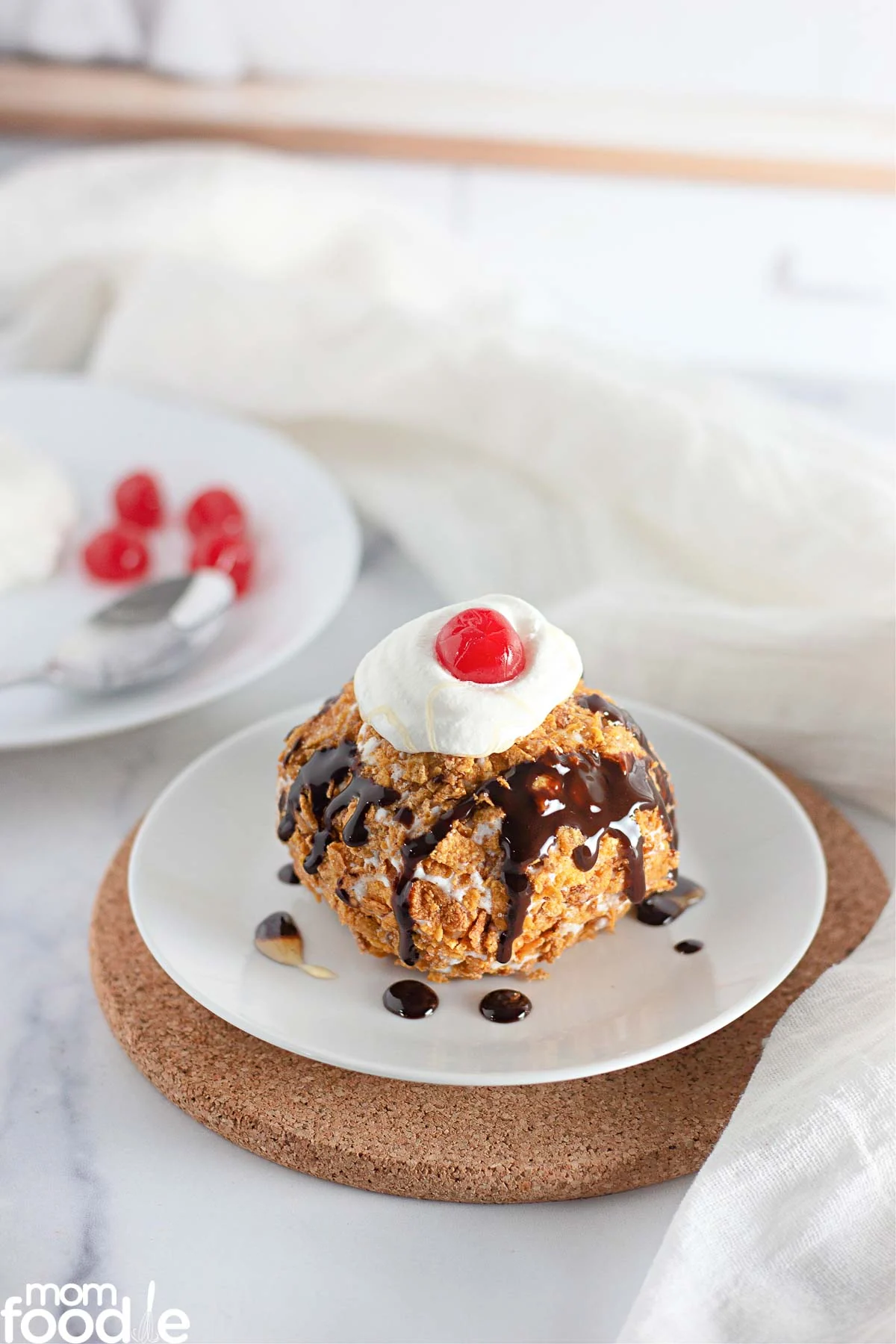 easy fried ice cream with syrup and whipped cream on top
