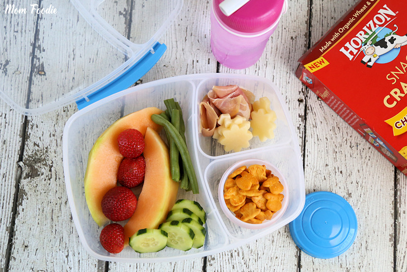 Healthy school lunch with school supplies. Overhead view double