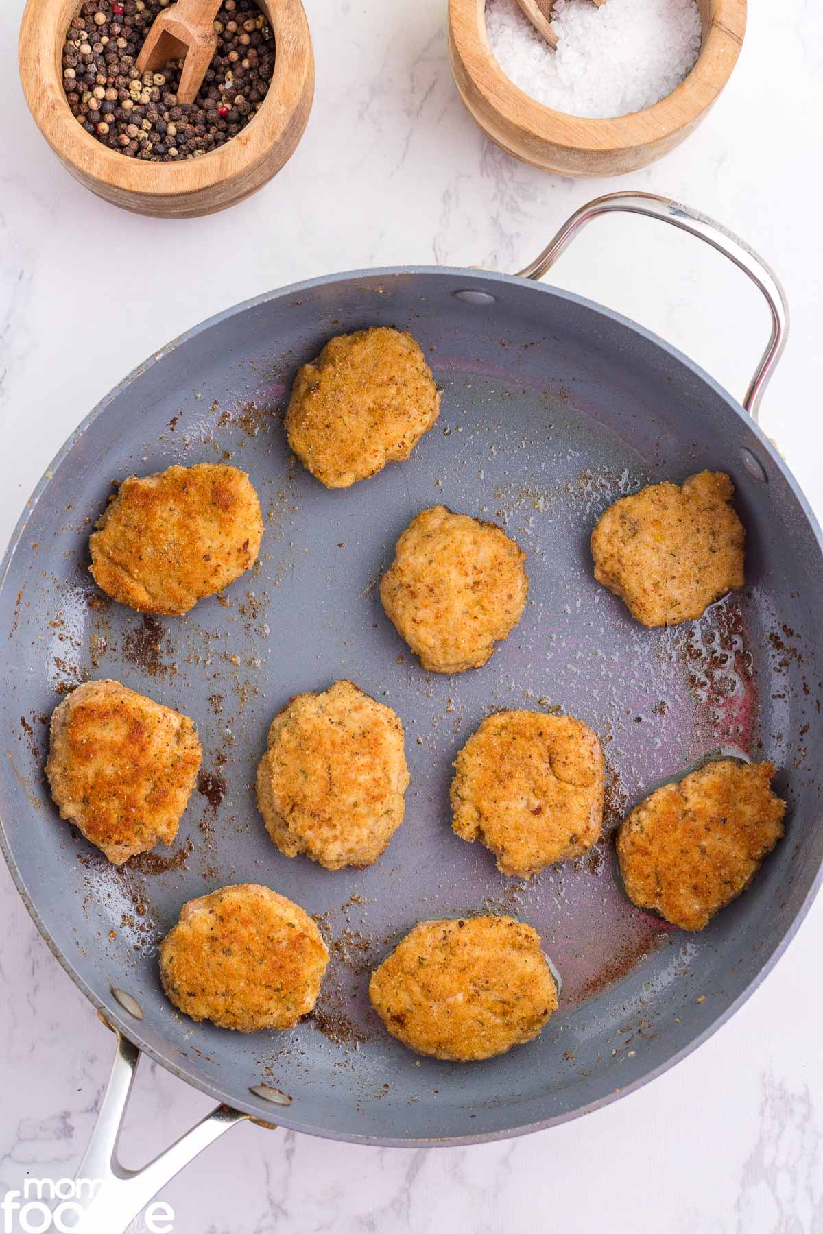 chicken nuggets with ground chicken fried in skillet