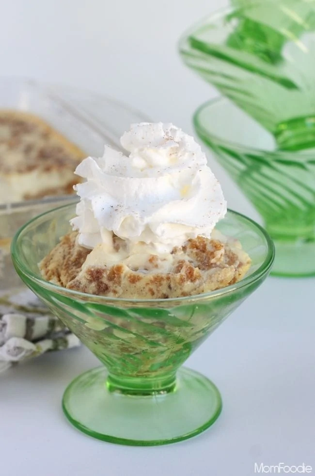 Grapenut Pudding in dessert dish with whipped cheam on top