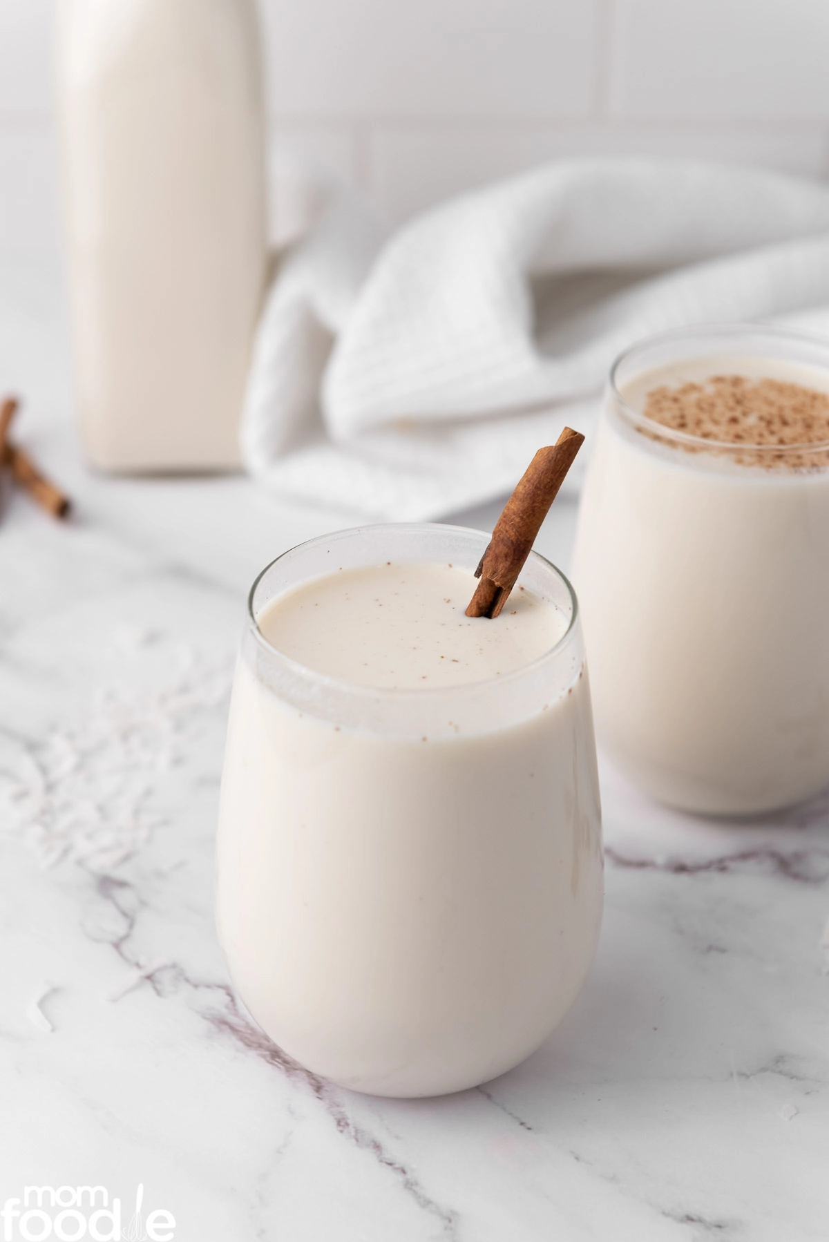 Puerto Rican Christmas drink with nutmeg and cinnamon stick