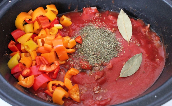 pasta sauce in the Crock pot with peppers and herbs,
