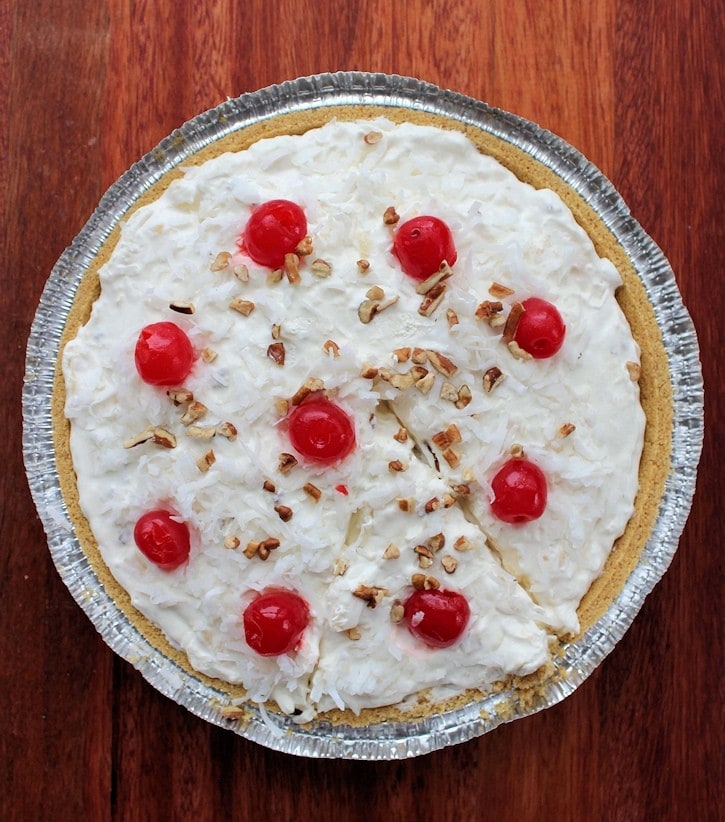 recipe million dollar pie in tin with slice ready to serve