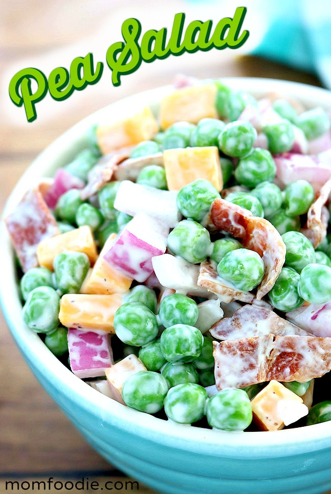 green pea salad with bacon bits, cheese and onions in bowl.