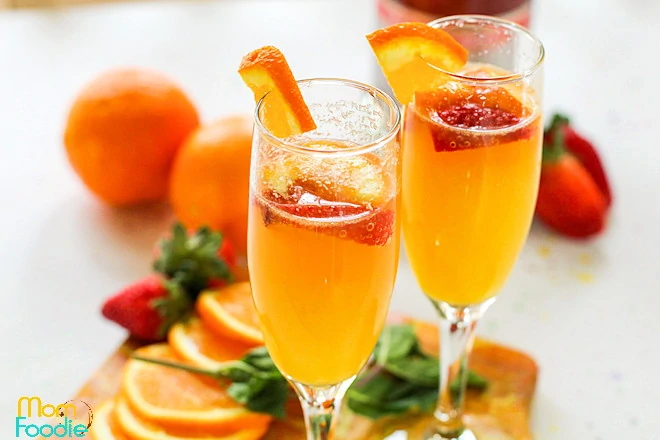 Pink Champagne Mimosas with strawberries 