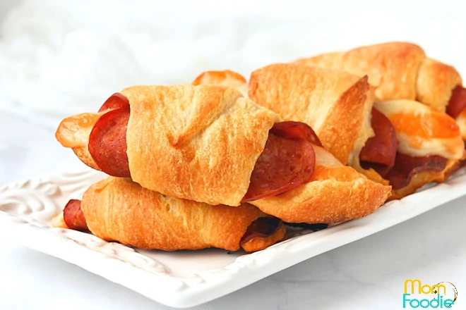 savory appetizers with crescent rolls, pepperoni and cheese.