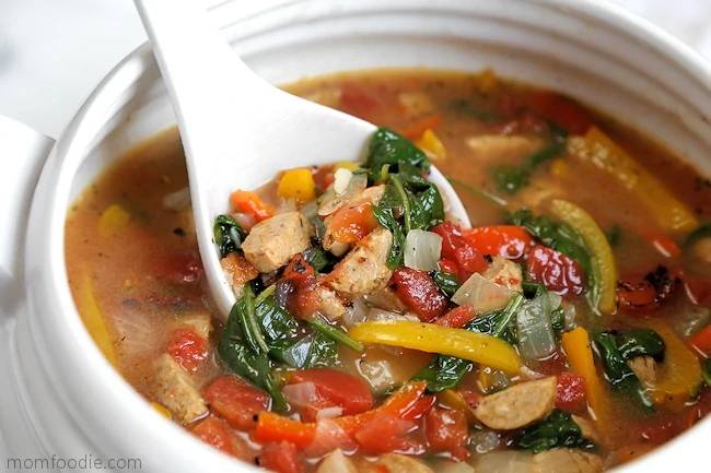 Sausage Pepper Soup in tureen with ladle.