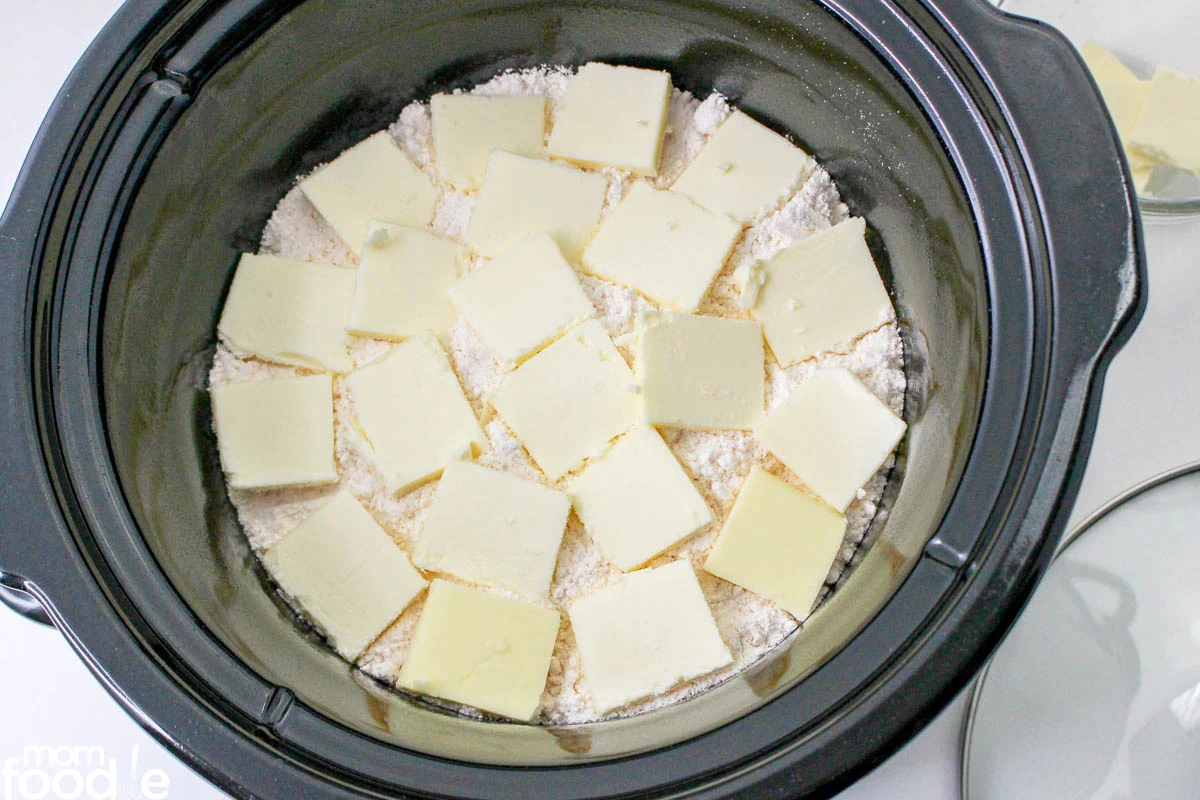 butter slices over cake mix