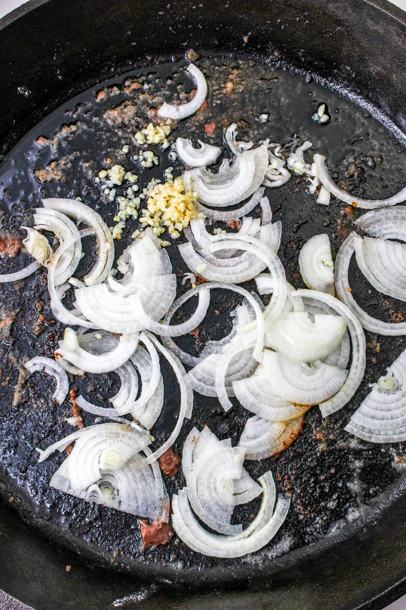 frying onions in cast iron pan
