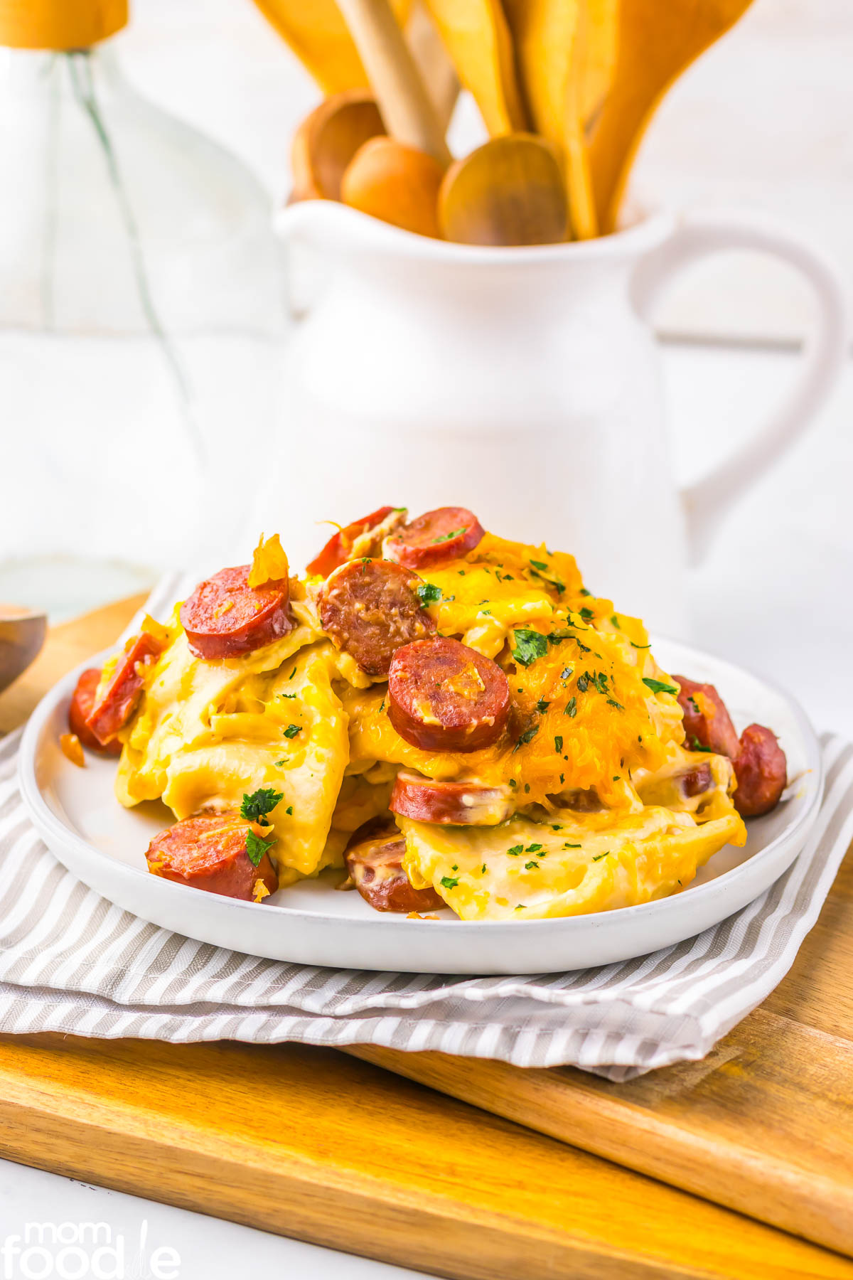 slow cooker pierogi casserole with kielbasa served on white plate