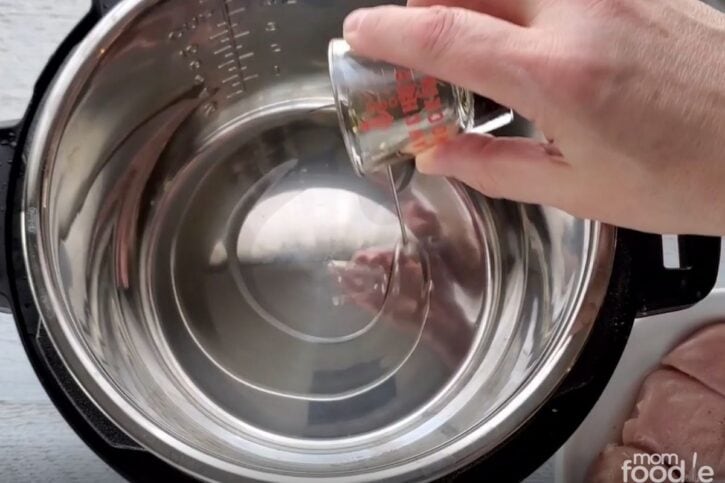 adding oil to the pot.