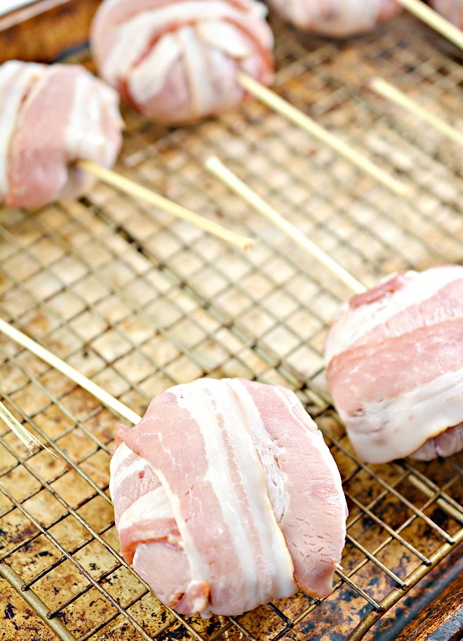 bacon wrapped cheeseburger pops ready for cooking